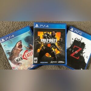PS4 games- barely used!!! CALL OF DUTY 4, WORLDWARZ, and MANEATER!!!
